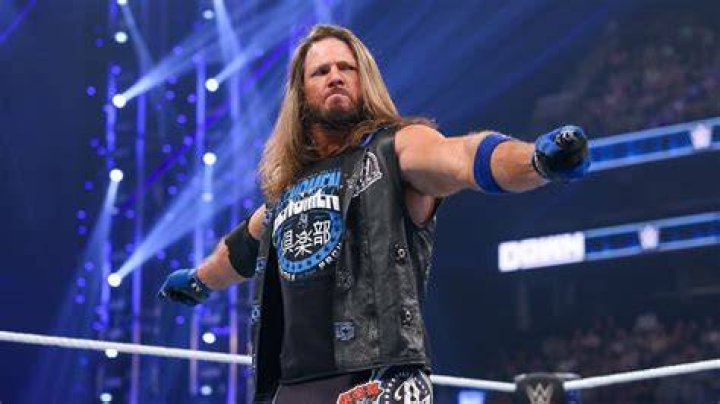 AJ Styles poses with The Club