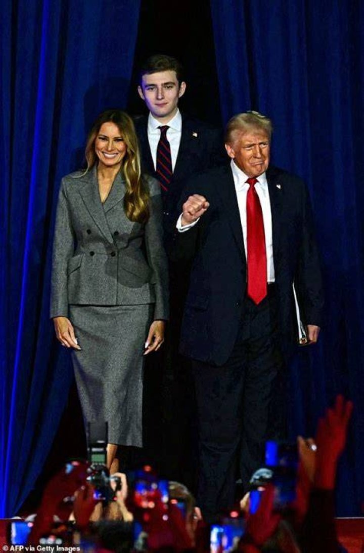 Barron Trump, 13, towers over his parents Donald and Melania Daily