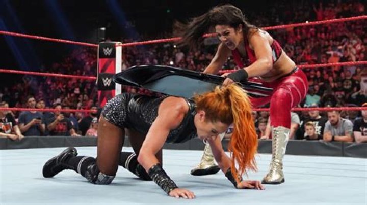 Becky Lynch attacks Bayley and Shayna Baszler