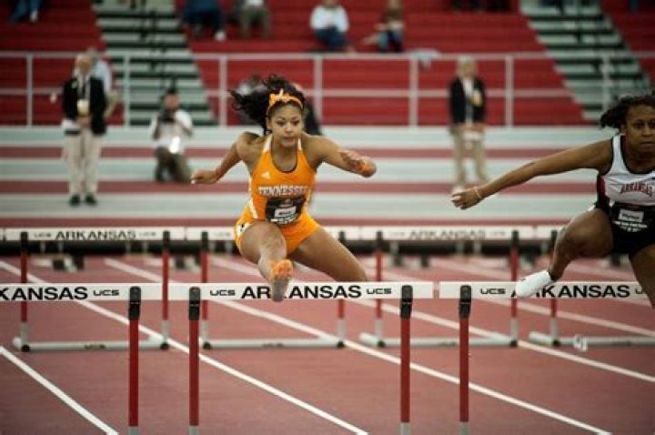 Bianaca Belair running on track