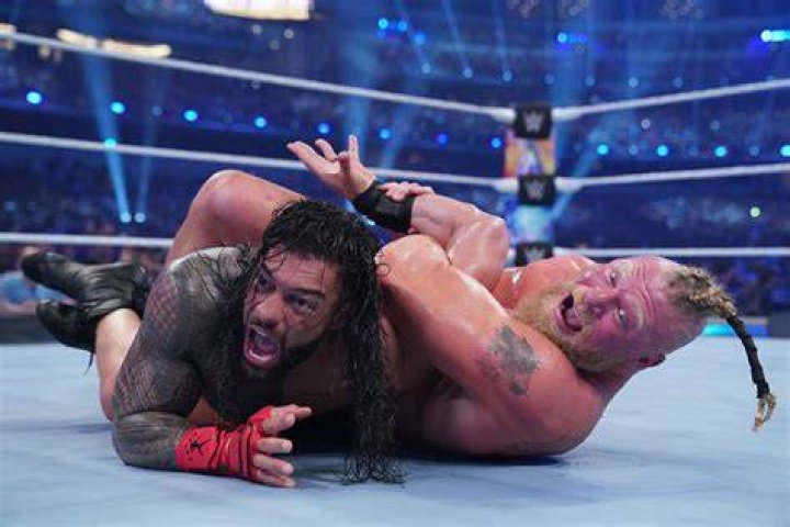 Brock Lesnar F5s Roman Reigns