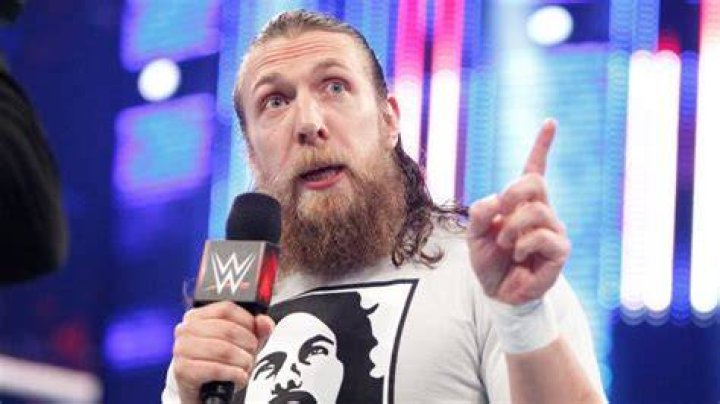 bryan danielson on the mic, looking down the camera