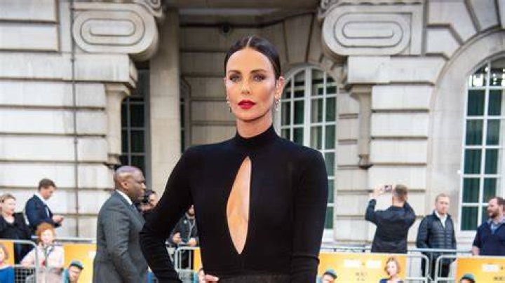 Charlize Theron as Morticia Addams in The ABSOLUTE Perfect Crossover Movie