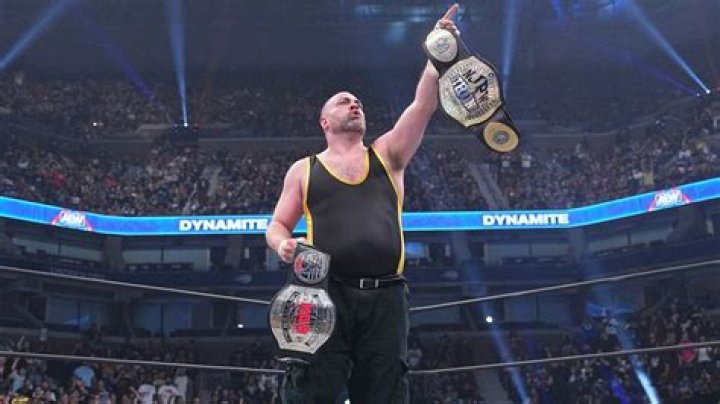 eddie kingston holding his titles, and bryan danielson