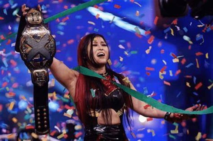 Io Shirai celebrating as NXT Women's Champion