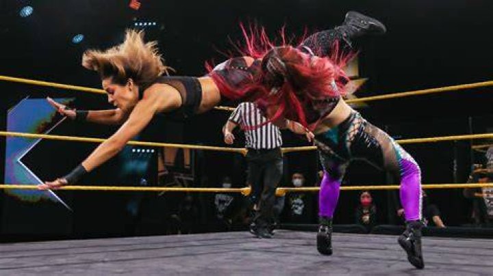 Io Shirai kicking Candice LeRae in NXT