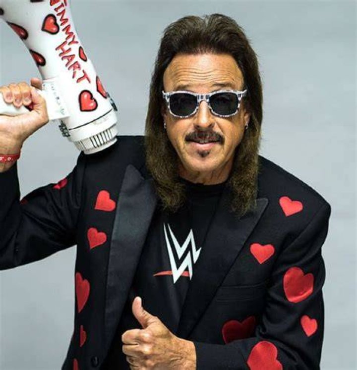 Jimmy Hart with his arms open.