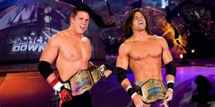 Miz and Morrison with their titles/SCU posing