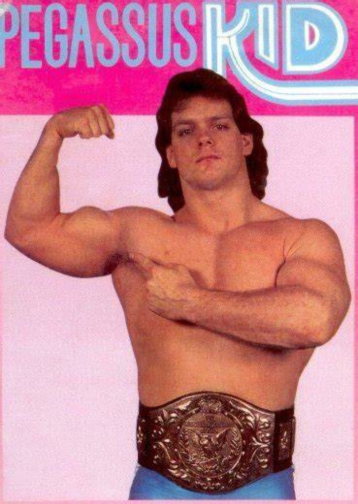 Pegasus Kid with the WWE Light Heavyweight Championship