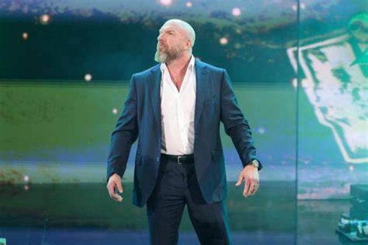 Picture of Triple H standing with Evolution.