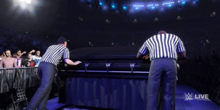 referees pushing a casket in wwe 2k24