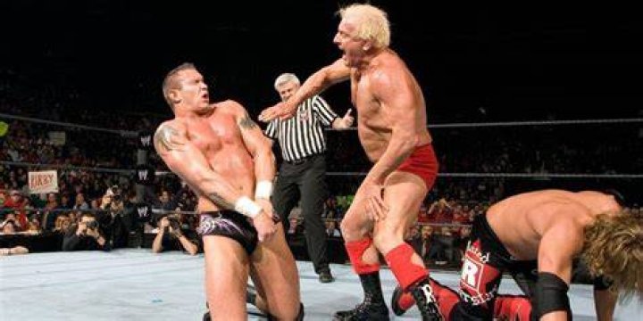 Ric Flair chops Randy Orton in WWE.
