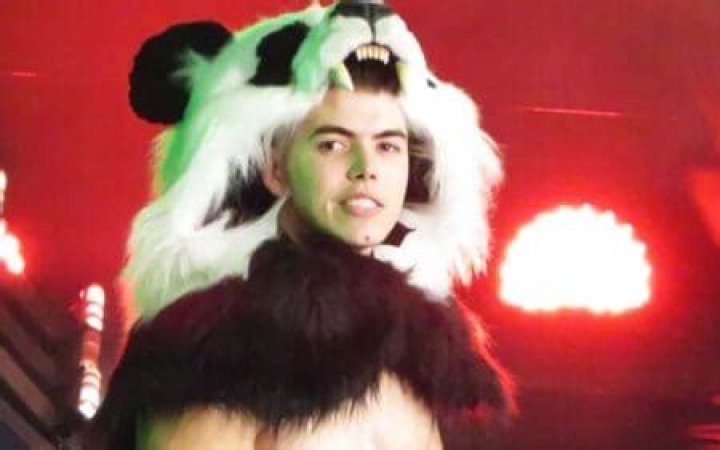 Sammy Guevara with a panda head 