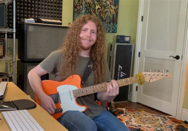 Sean Ashe guitar in hand interview with the talented musician