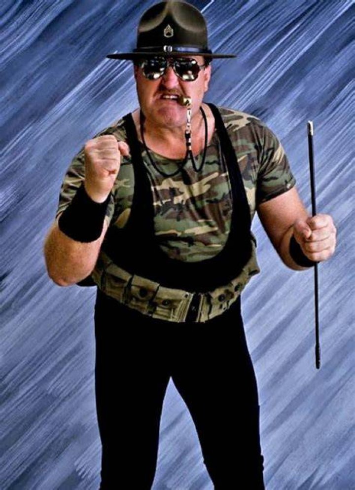 Sgt. Slaughter applying a Crobra Clutch on Pat Patterson. 