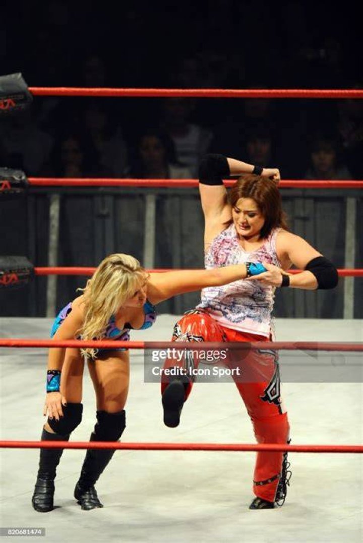 Taylor Wilde and Hamada with the Impact Knockouts Tag Team Championship