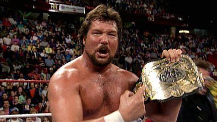 Ted DiBiase wearing the WWE Championship. 