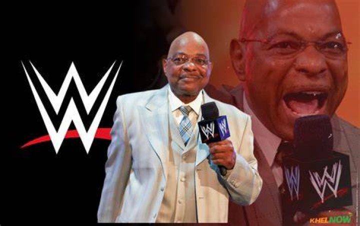 Teddy Long outside the ring with his fellow WWE referee.