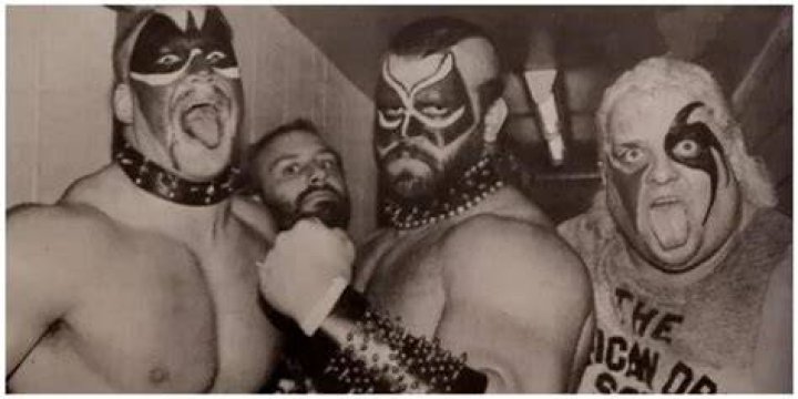 The Road Warriors and Dusty Rhodes backstage together.