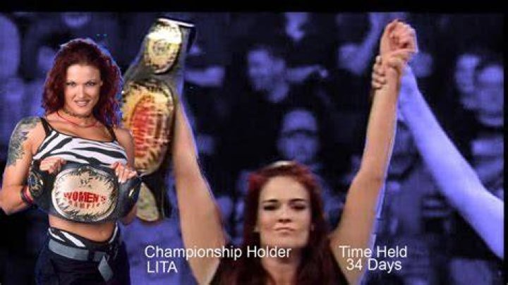 WWE Lita Holding The Women's Championship Beside The Rock And The Hardy Boys